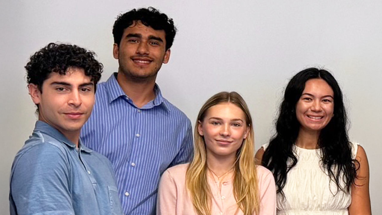 Students smiling for the camera. 